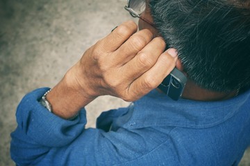 Portrait of senior man talking phone