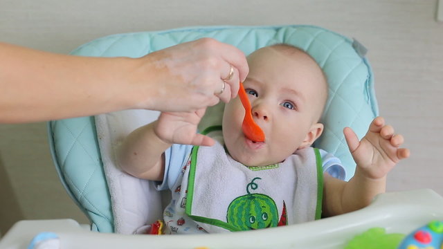 Mother Feeding Little Baby