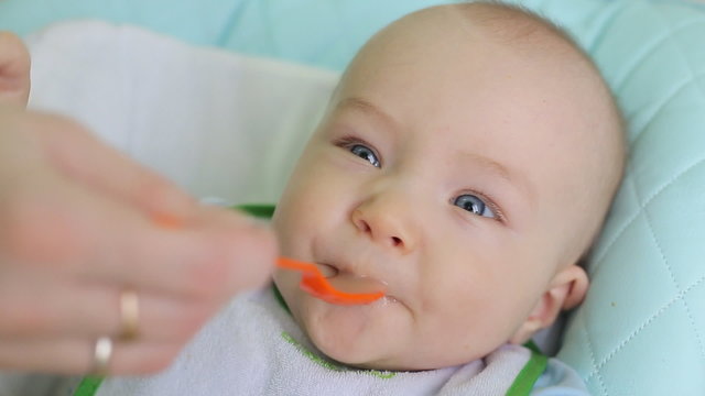Mother Feeding Little Baby