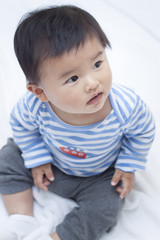 Cute Chinese baby boy in sailor suit