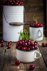 fresh cherries in enamel kitchenware