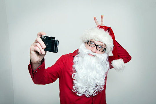 Hipster Santa fool around making selfie