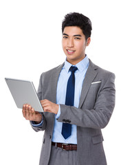 Asian businessman use of the tablet pc
