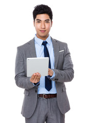 Asian young businessman use of the digital tablet