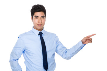 Businessman with finger point aside