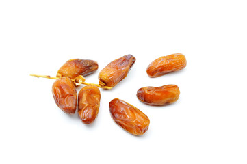 Dried Kurma. popular in month of Ramadhan. also known as a diet dish..Eaten in fasting month for muslim people. Pile of dried date fruits isolated on a white background.