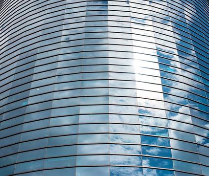 Modern round glass building in the city.