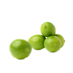 Pile of multiple ripe limes, composition isolated over the white