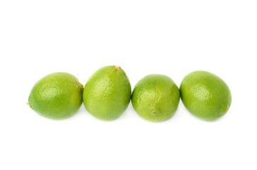 Four limes fruits composition isolated over the white background