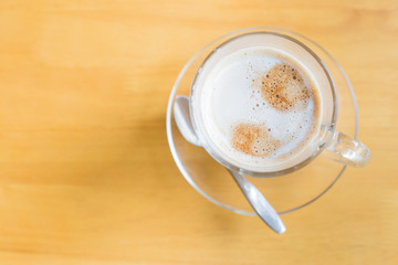 hot latte coffee on wooden table, vintage and retro style