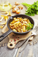 Fried potatoes with mushrooms