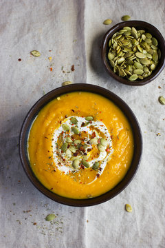 pumpkin soup with pumpkin seeds  on a bowl