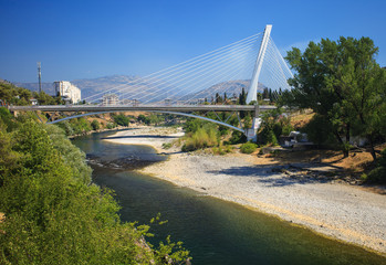 View of Millennium bridge over Moraca river in the center of Podgorica, Montenegro