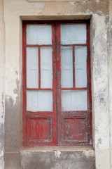 Fototapeta na wymiar Red door weathered wood