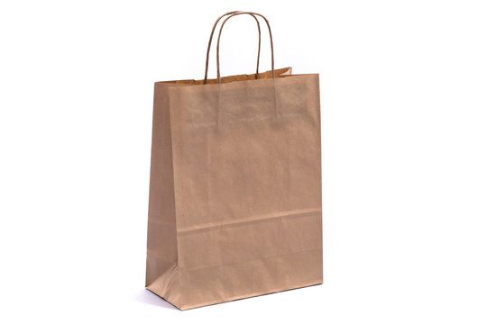Brown shopping bag with handles on a white background