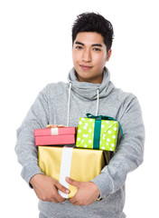 Man hold with lots of gift box