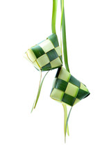 Ketupat or rice dumpling is a local delicacy during the festive season.  Ketupats, a natural rice casing made from young coconut leaves for cooking rice on white background