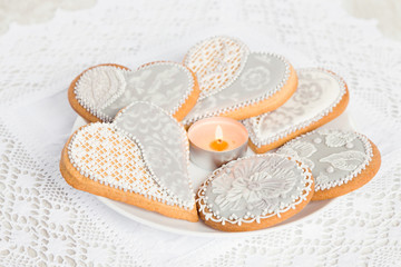 Gingerbread cookies in heart shape on white plate