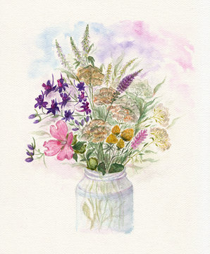 Bouquet of watercolor colorful wildflowers in glass vase 