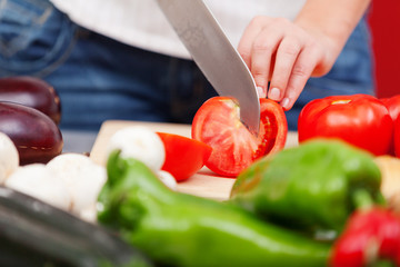 Young woman making salad
