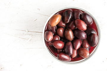 Kalamata olives in   brine on the glass dish horizontal