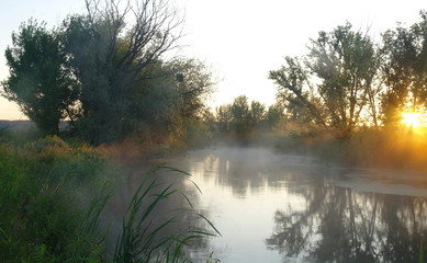 Morning landscape with fog on the river