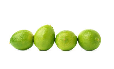 Four limes fruits composition isolated over the white background