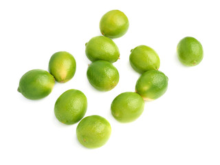 Surface covered with multiple ripe limes, composition isolated