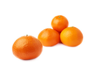 Pile of multiple ripe fresh juicy tangerines, isolated over the