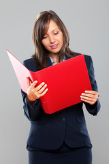 Businesswoman holding folders