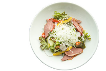Salad with arugula and duck breast.