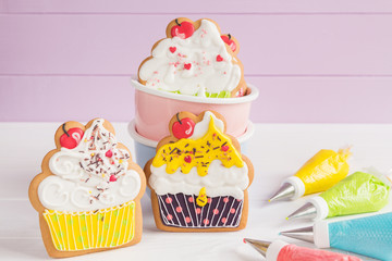 Colorful icing cookies in cupcake shape