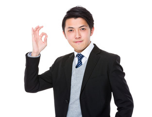 Asian businesswoman with ok sign gesture
