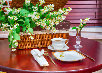 set of dishes and jasmine flowers