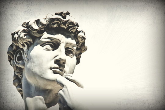 Grunge detail  of Michelangelo's David statue with   place for your design or text