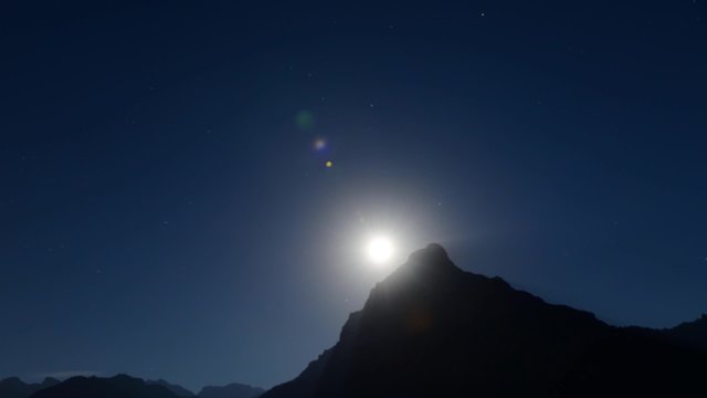 Magnificent night sky and stars. Moon over mountain top. Time Lapse