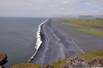 Dyrhólaey peninsula in south Iceland, coastline with black sand