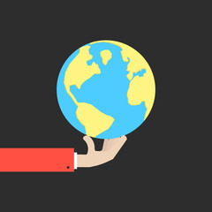 hand holding blue and yellow earth