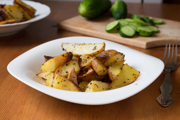 Roasted potato cooked in oven with herbs and olive oil