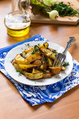 Roasted potato cooked in oven with herbs and olive oil