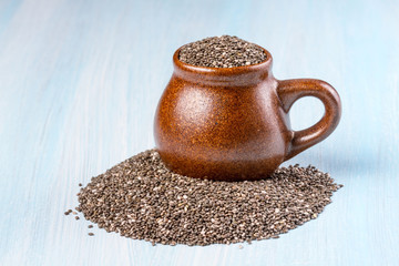 Chia seeds on wooden background