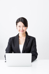 asian businesswoman using laptop