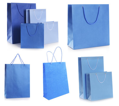 Blue paper shopping bags isolated on white