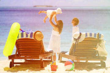 chairs on tropical beach, family vacation concept