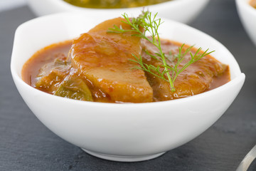Chilli Potatoes - Potatoes wedges cooked in a hot and spicy chilli sauce.
