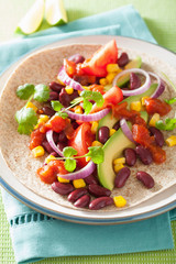 vegan taco with vegetable, kidney beans and salsa