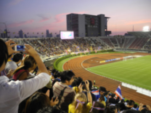 defocused background of soccer or football stadium at twilight,Thailand