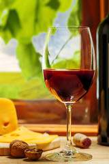 Glass of red wine on table