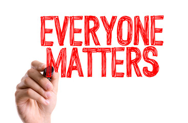 Hand with marker writing the word Everyone Matters