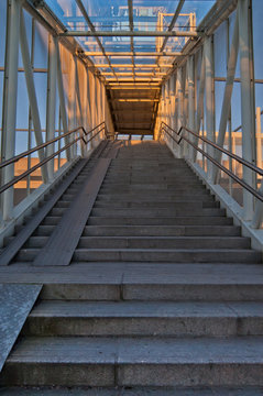 Staircase at railway station at sunset.
